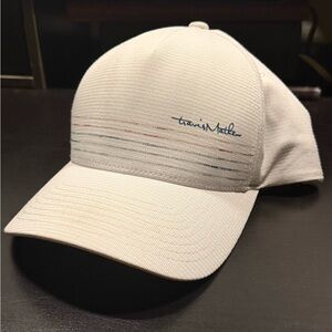 Travis Mathew White Cap with Blue and Red Accents